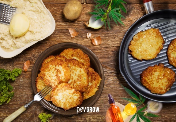 Image of delicious latkes on a plate with the odd bud on the table as a garnish.